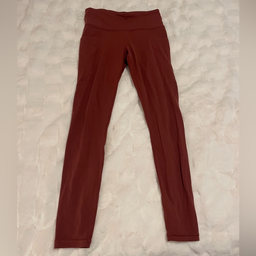 Gently worn Athleta leggings with pockets, size small